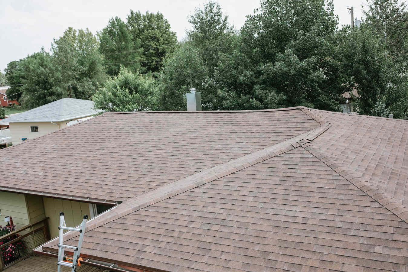 Residential home with new asphalt shingle roof in North Dakota